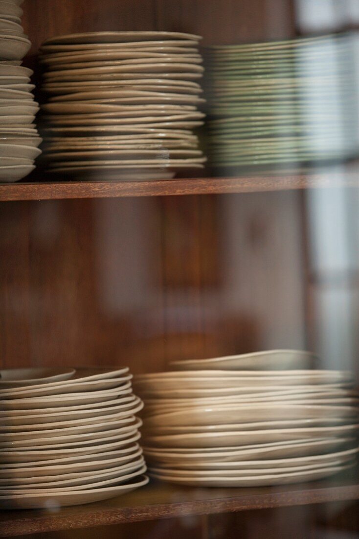 Stacked plates in the kitchen cupboard