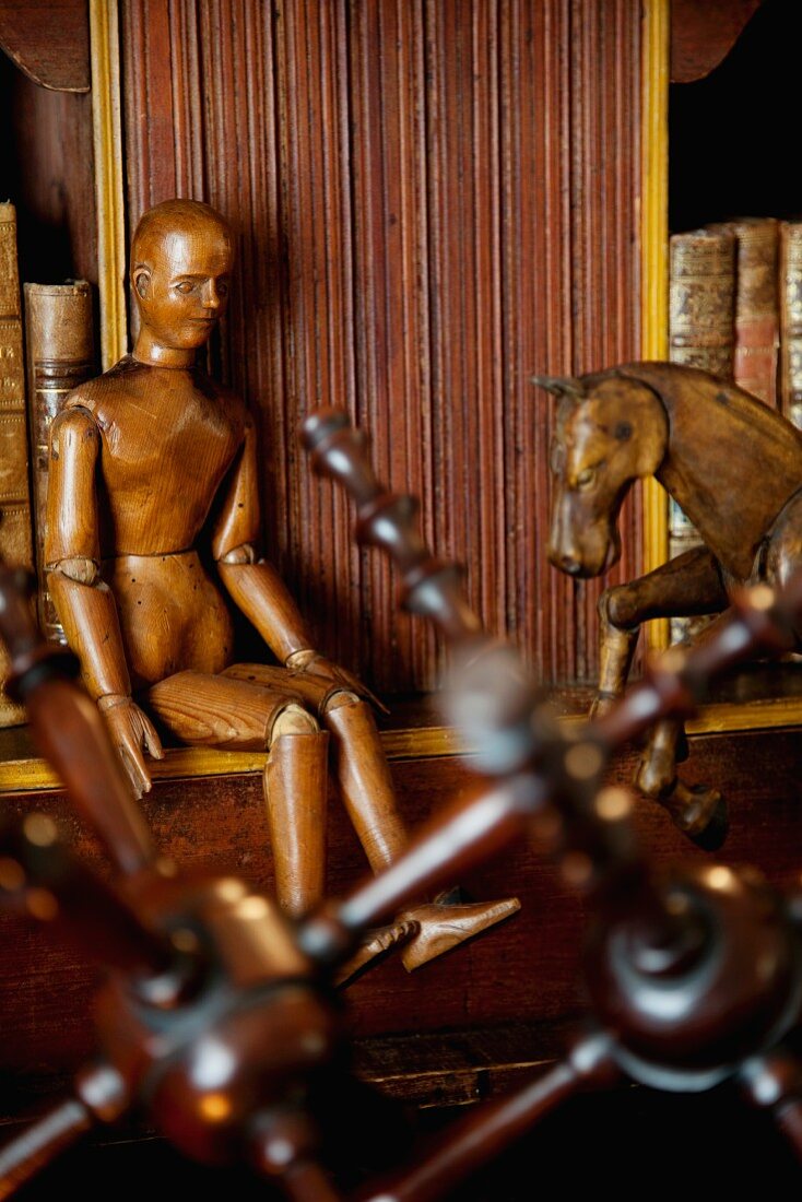 Antique and wooden horse on a writing desk from the German Imperial Era