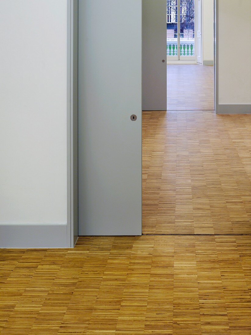Rooms with parquet flooring throughout and a view through open sliding doors (Goethe Institut, London)