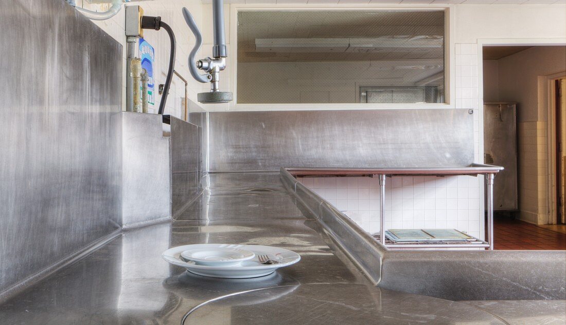 Large stainless steel surfaces in restaurant kitchen