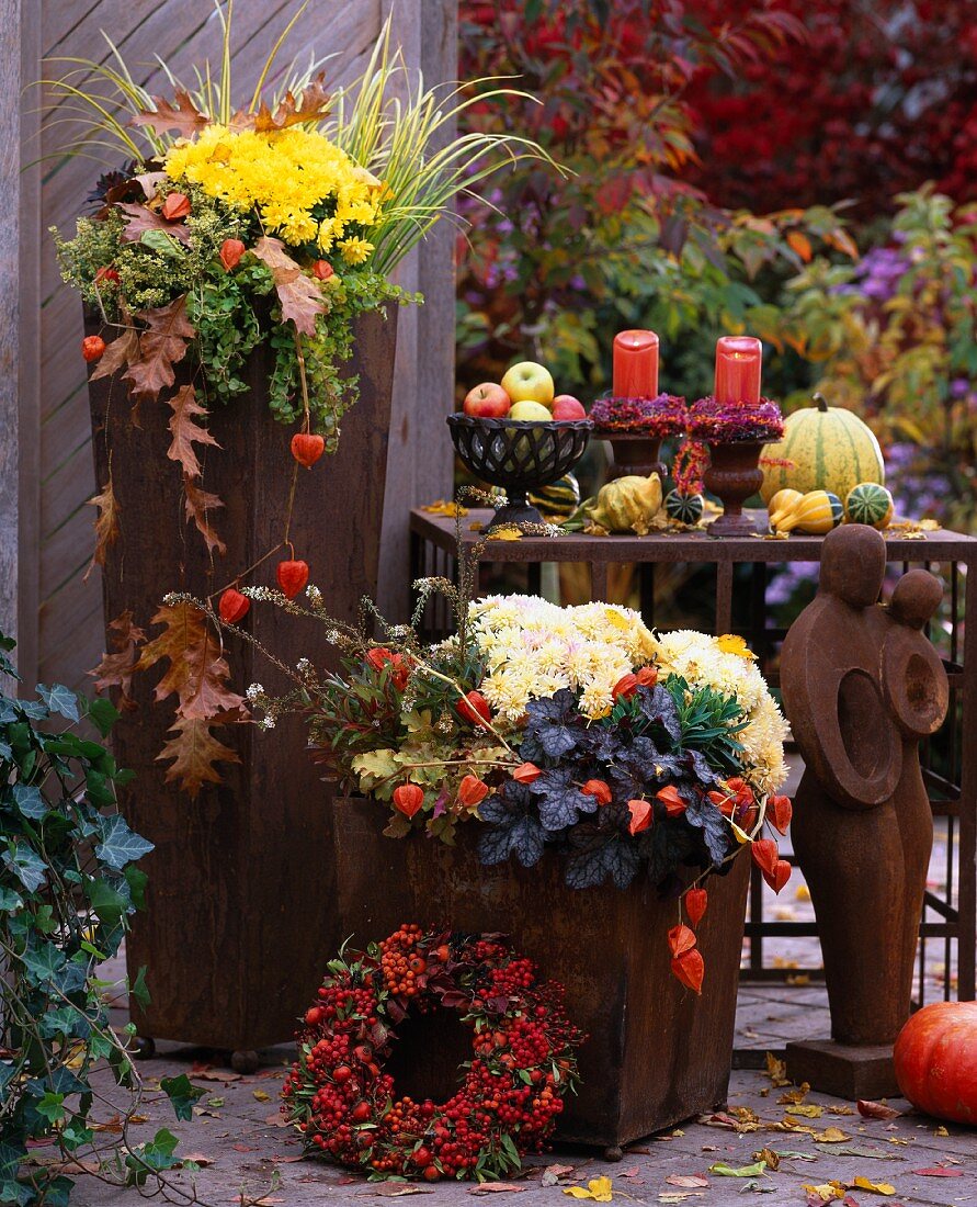 Autumn flowers in rusty vases