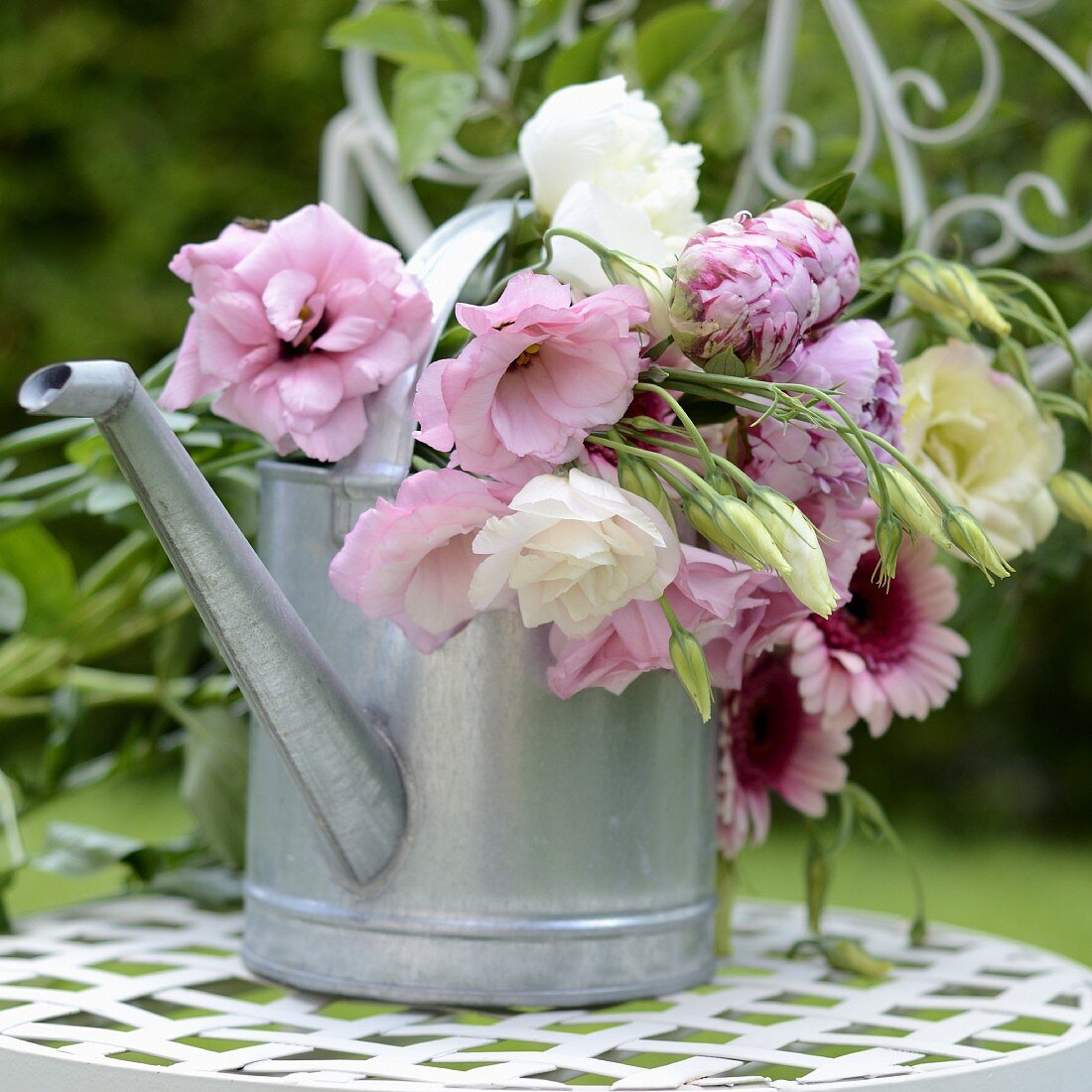 Summer bouquet in watering can