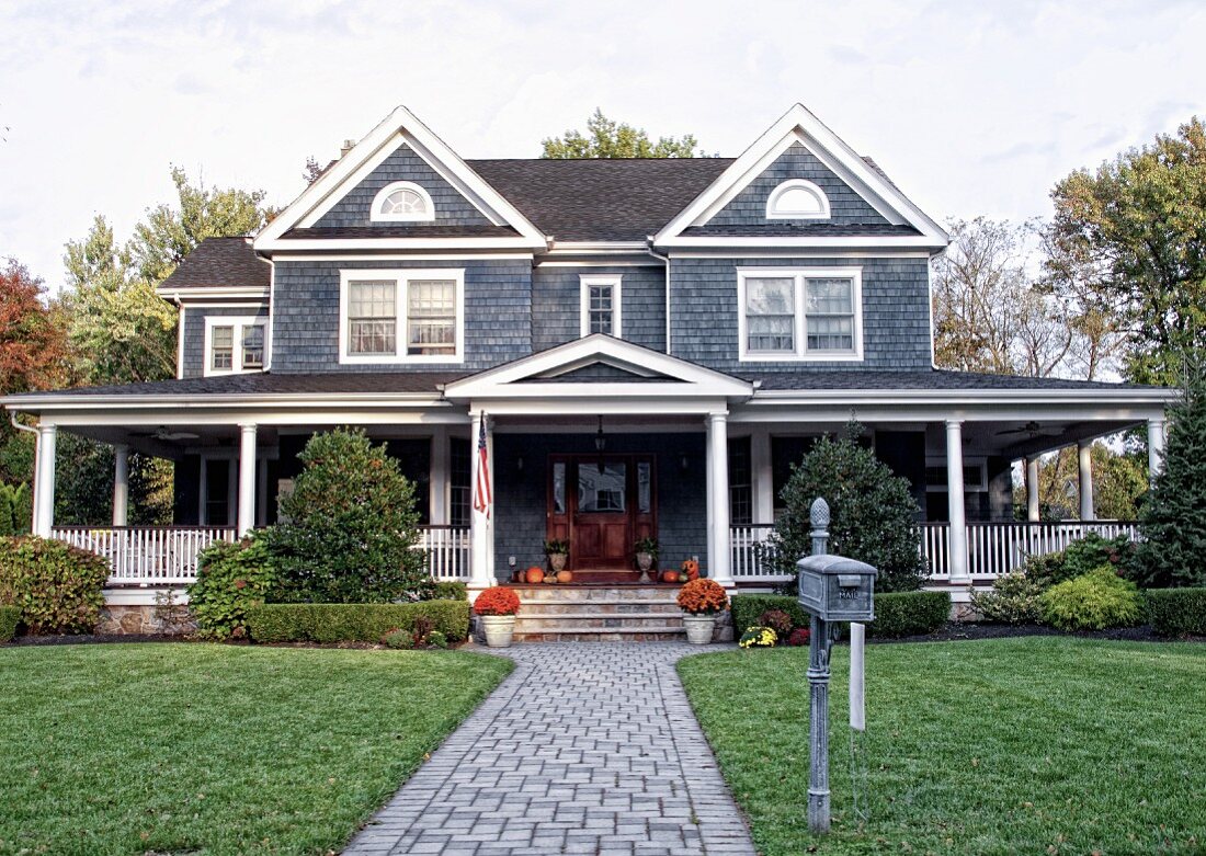 Exterior of a Shingled Home with a Large Front Porch