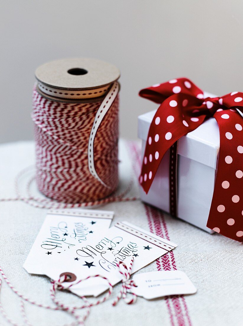 Festive gift tags, ribbon and gift box