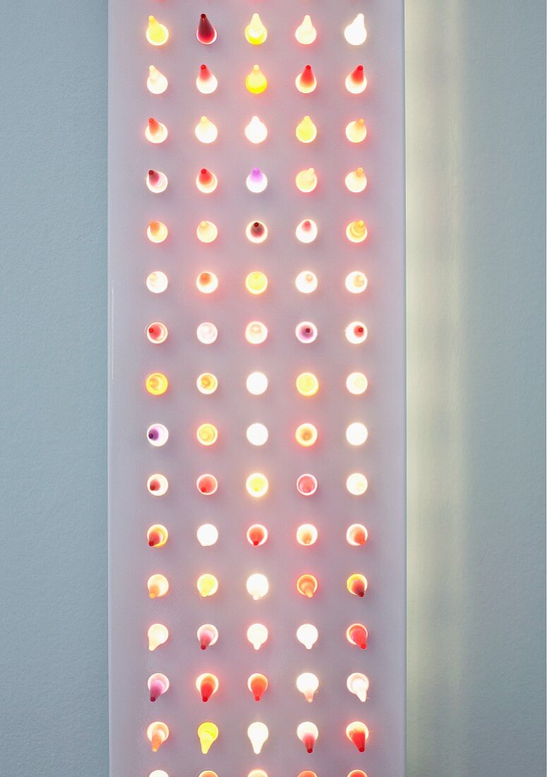 Modern, flat light sculpture with dots of light