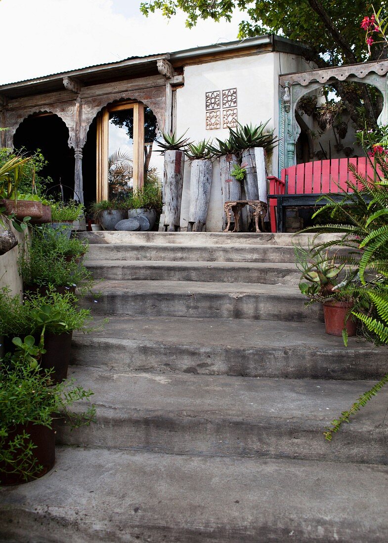 Stone garden steps in front of building with veranda