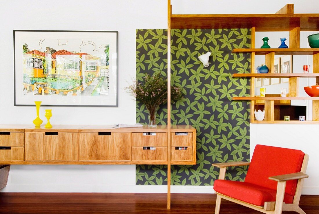 Floating sideboard and open shelving in wall aperture next to patterned panel