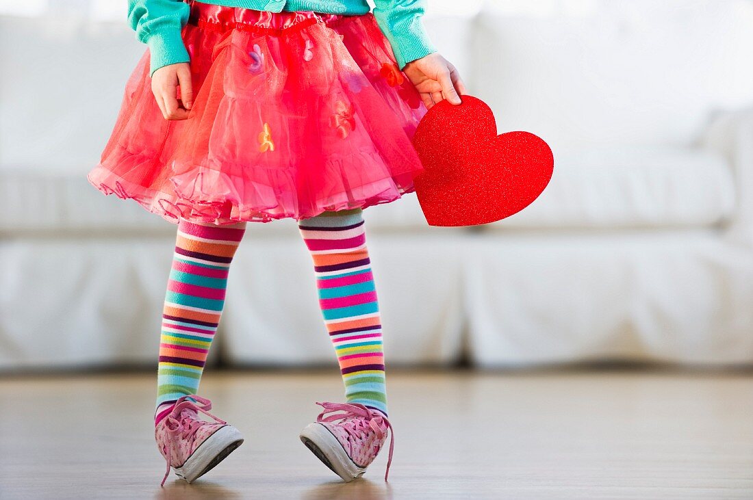 Young girl wearing colorful tights