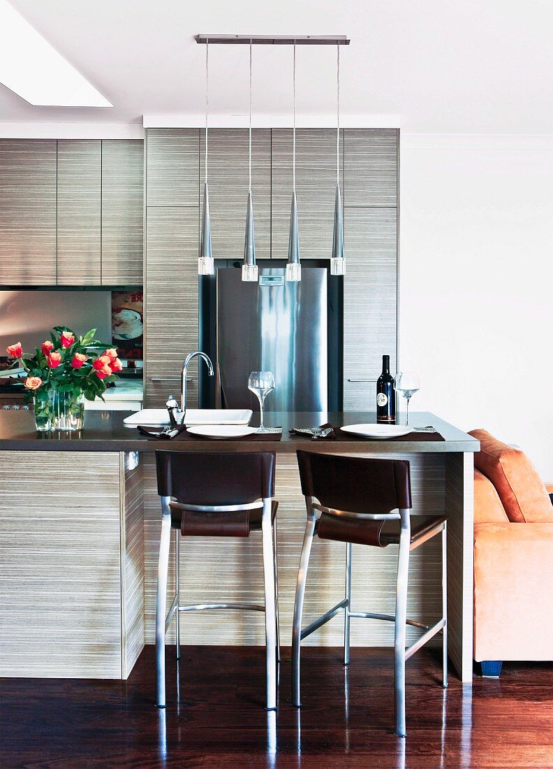 Open kitchen with breakfast bar and chrome bar stools