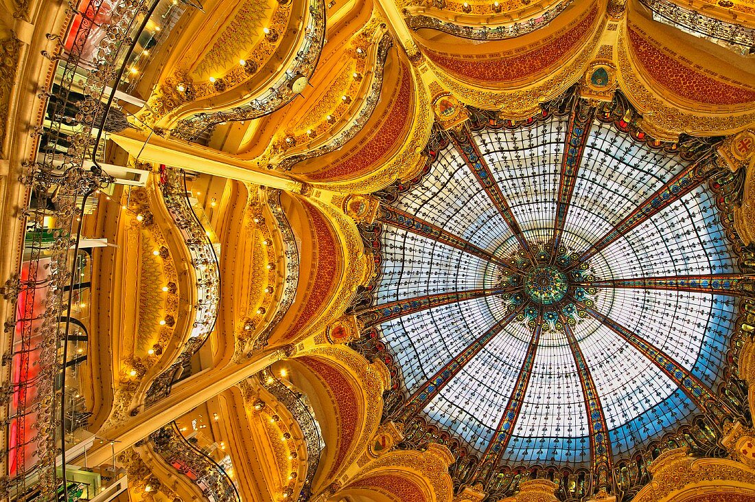 The stained glass dome of Galeries Lafayette, a large opulent art nouveau and historic department store in the centre of Paris