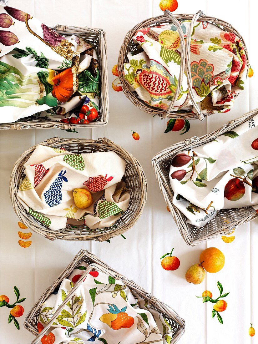 White-painted baskets covered with cheerful linen napkins