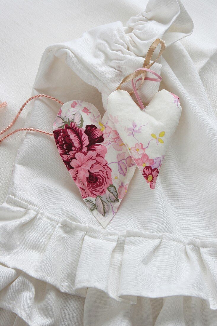 Hand-sewn fabric hearts on pleated laundry bag