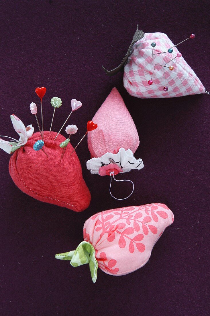 Hand-sewn, strawberry-shaped pin cushions
