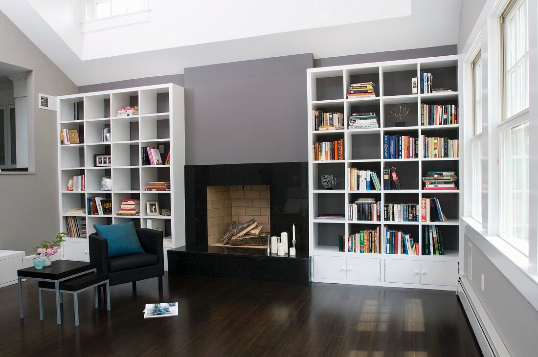 Elegant Interior With Fireplace Flanked, Dark Hardwood Floors With Grey Walls