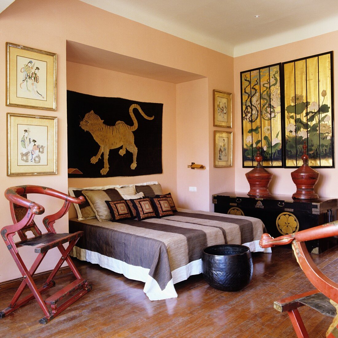 Bedroom in mixture of ethnic styles with antique, Oriental collectors' items