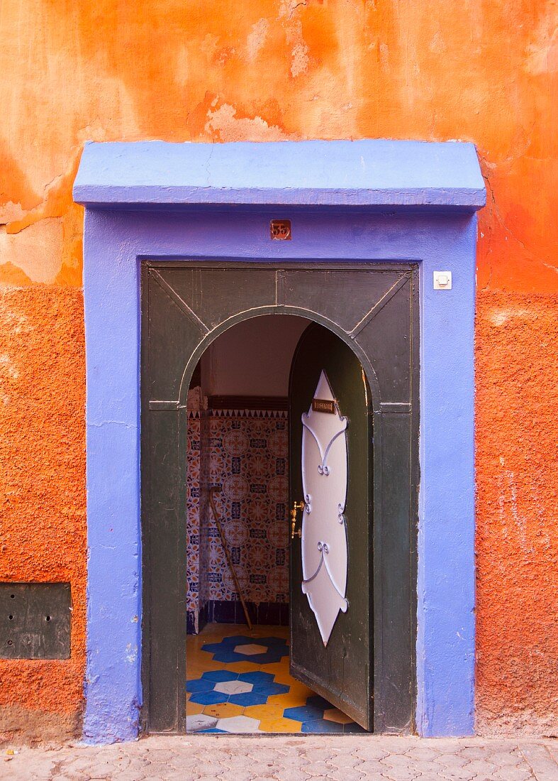 Colourful house entrance with open door (Morocco)