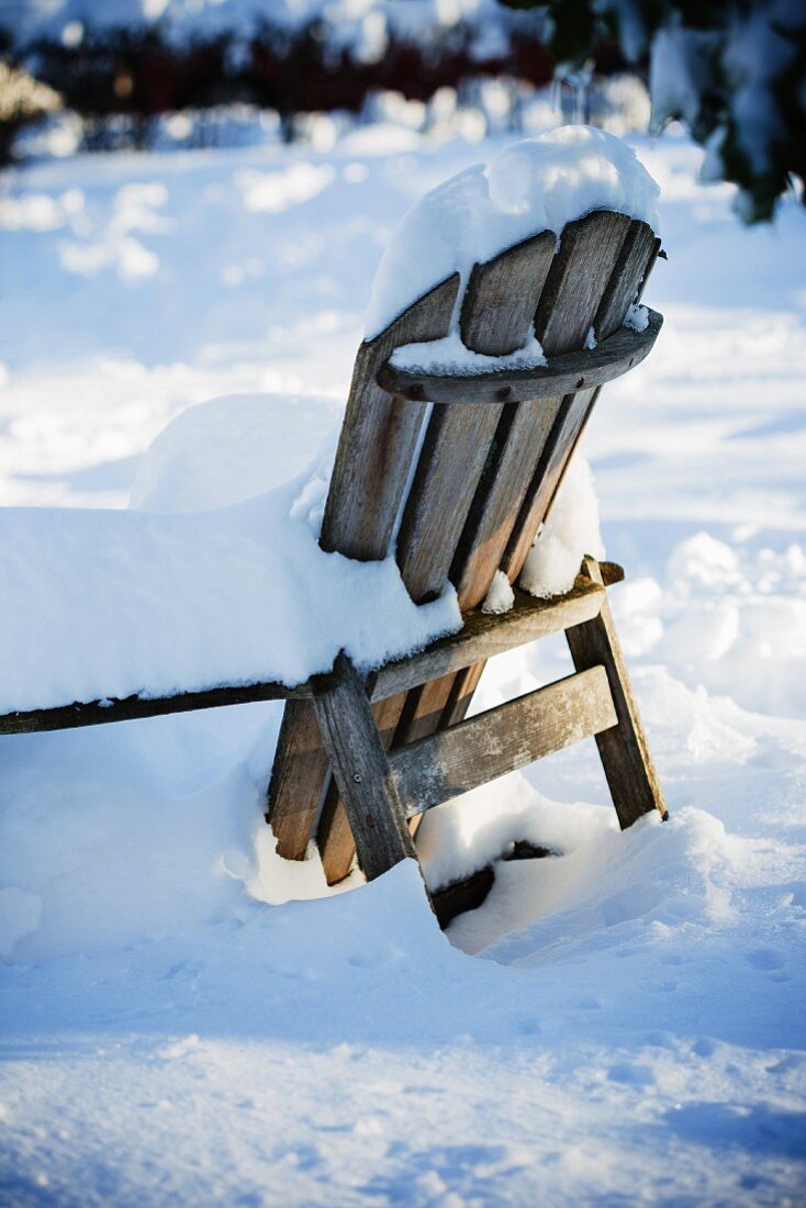 Snow Covered Wooden Chair