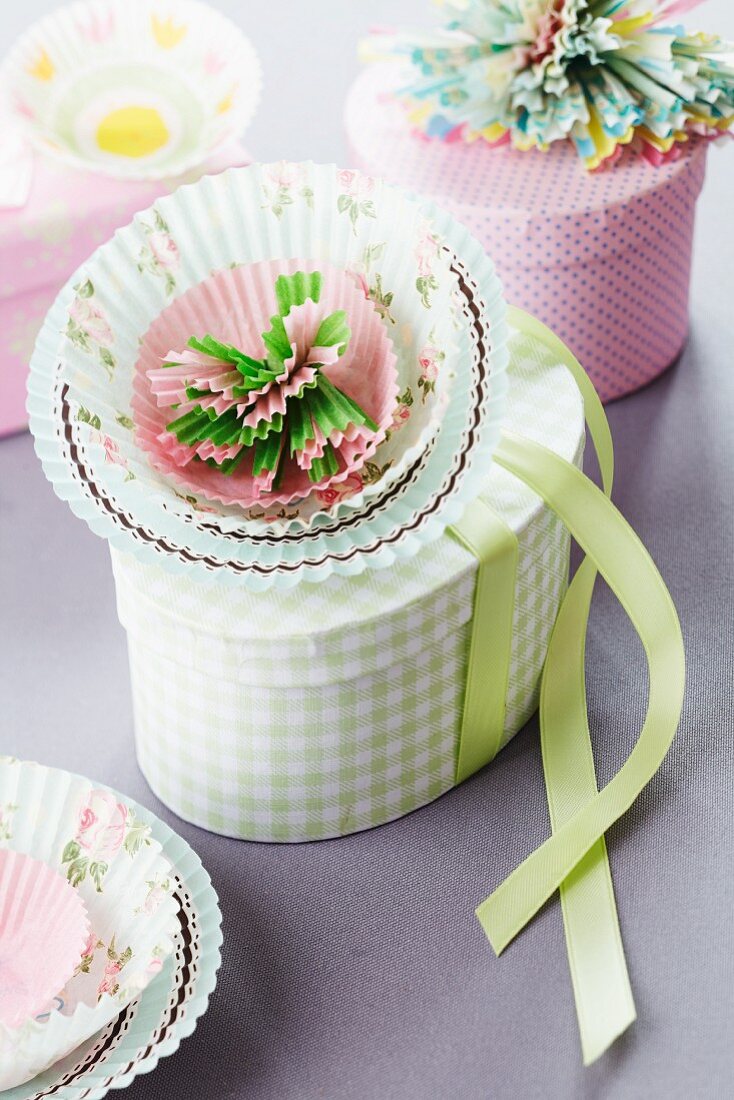 Paper flower made from paper cake cases decorating gift box