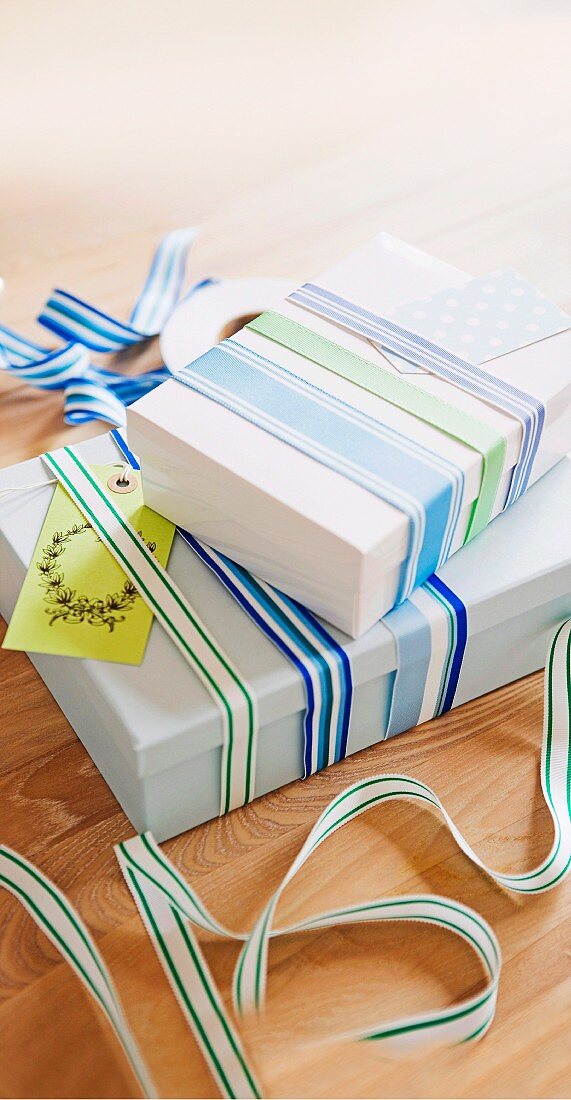 Gift boxes wrapped with various striped ribbons