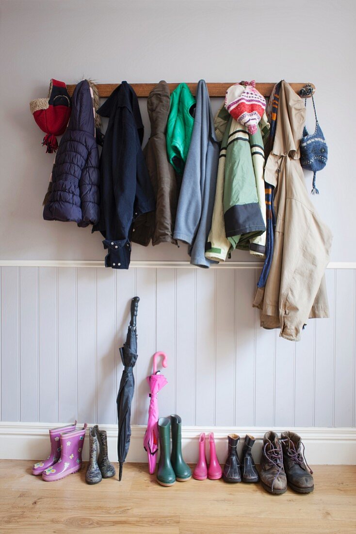 Cloak room with assorted jackets and shoes