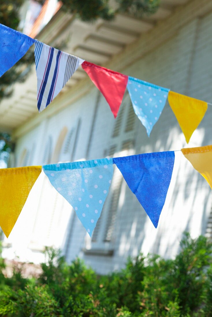 Colorful pennant in front of a house