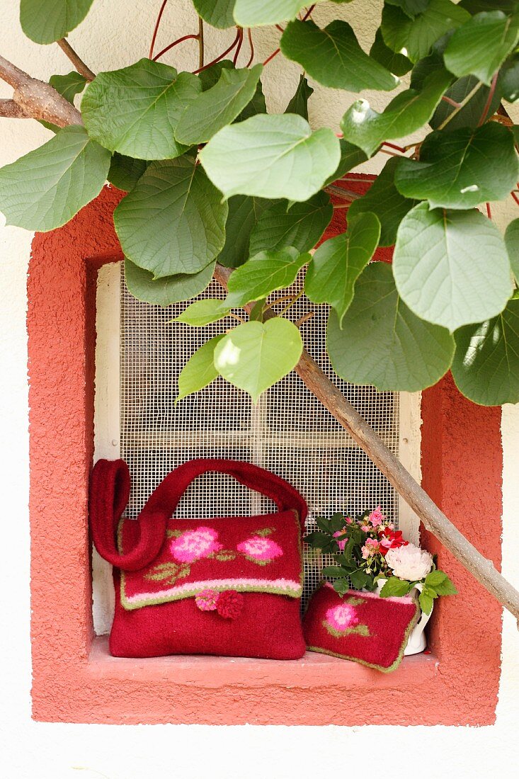 Hand-made felt bags with rose motifs