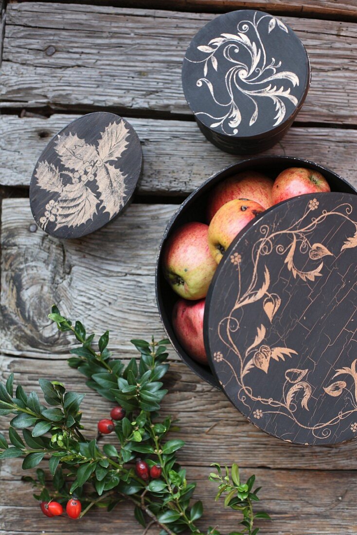 Dark chipwood boxes hand painted with floral motifs