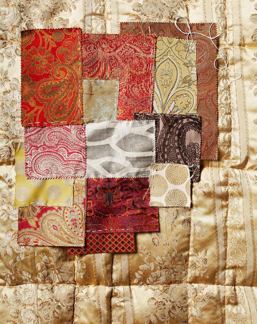 Swatches of various elegant silk and brocade fabrics