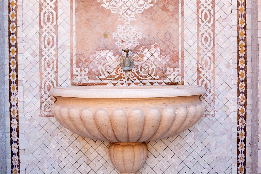 Oriental wall fountain with mosaic tiles