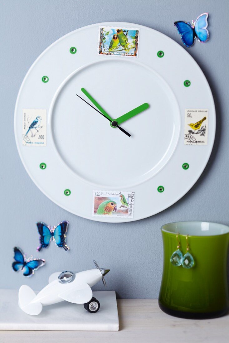 Plate decorated with pretty postage stamps turned into clock