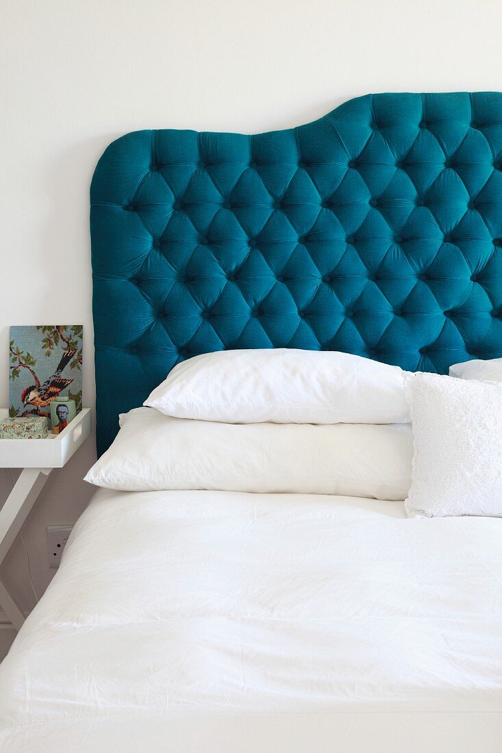 Double bed with petrol blue, quilted headboard