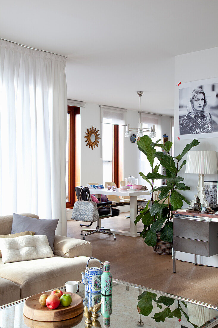 Bright living room and dining area with large windows