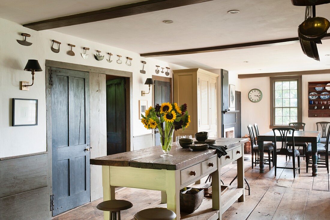 Open-plan, country-house-style kitchen-dining room in restored, historical house