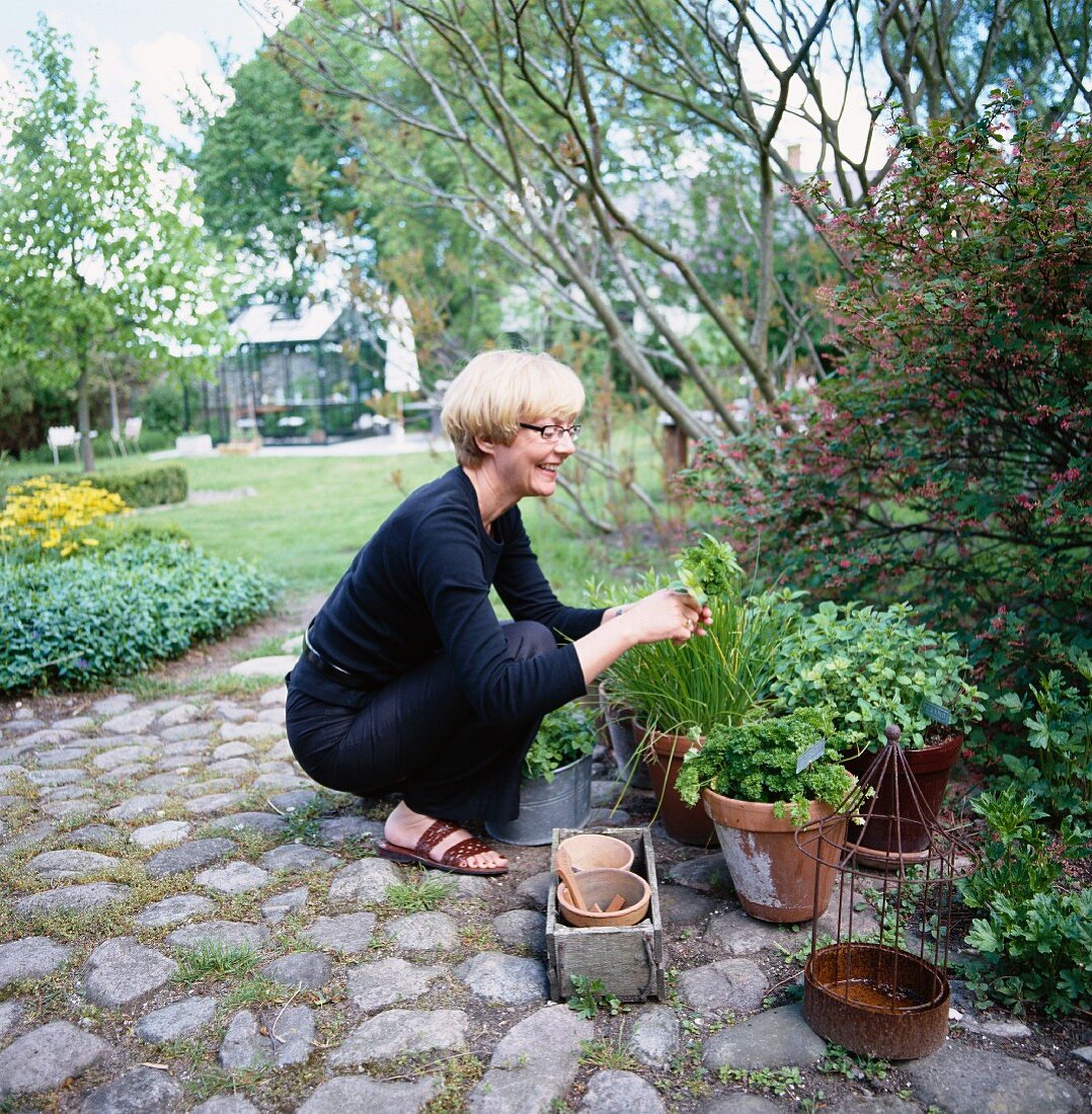 A woman in a garden, Sweden.
