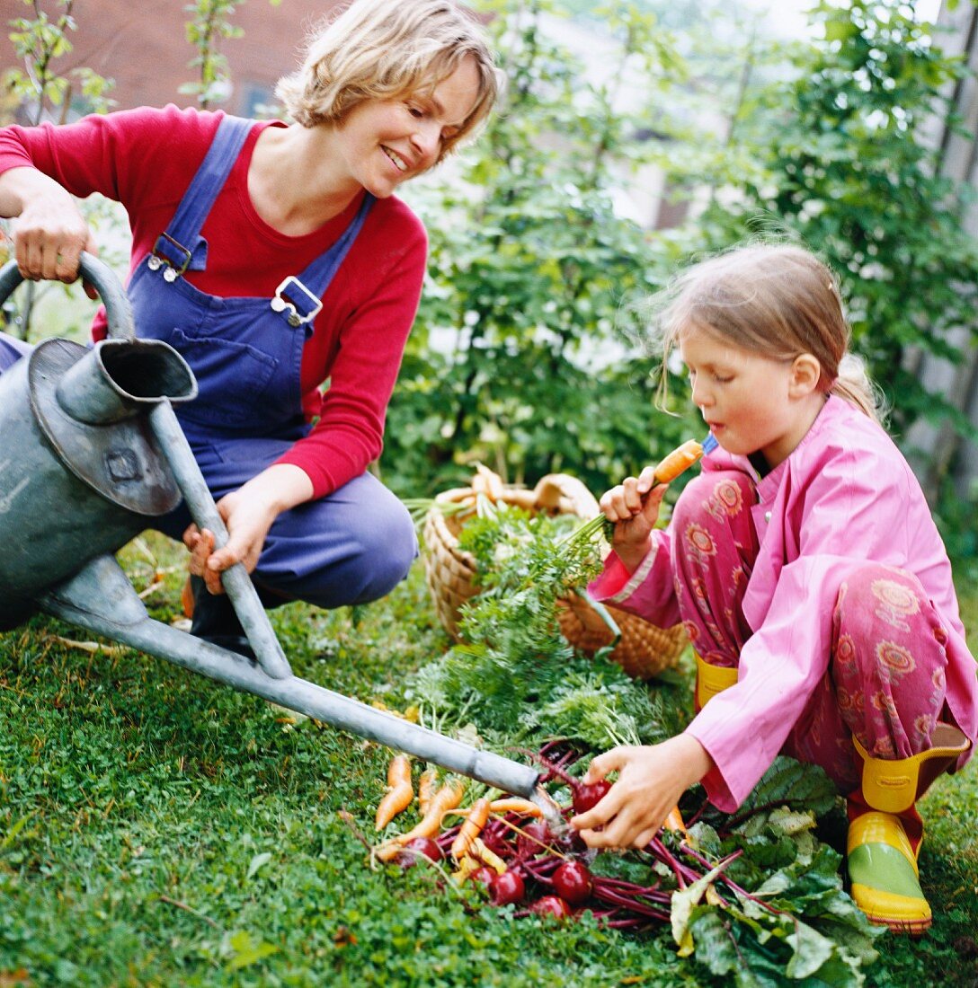 Mother and daughter with vegetables, Sweden.