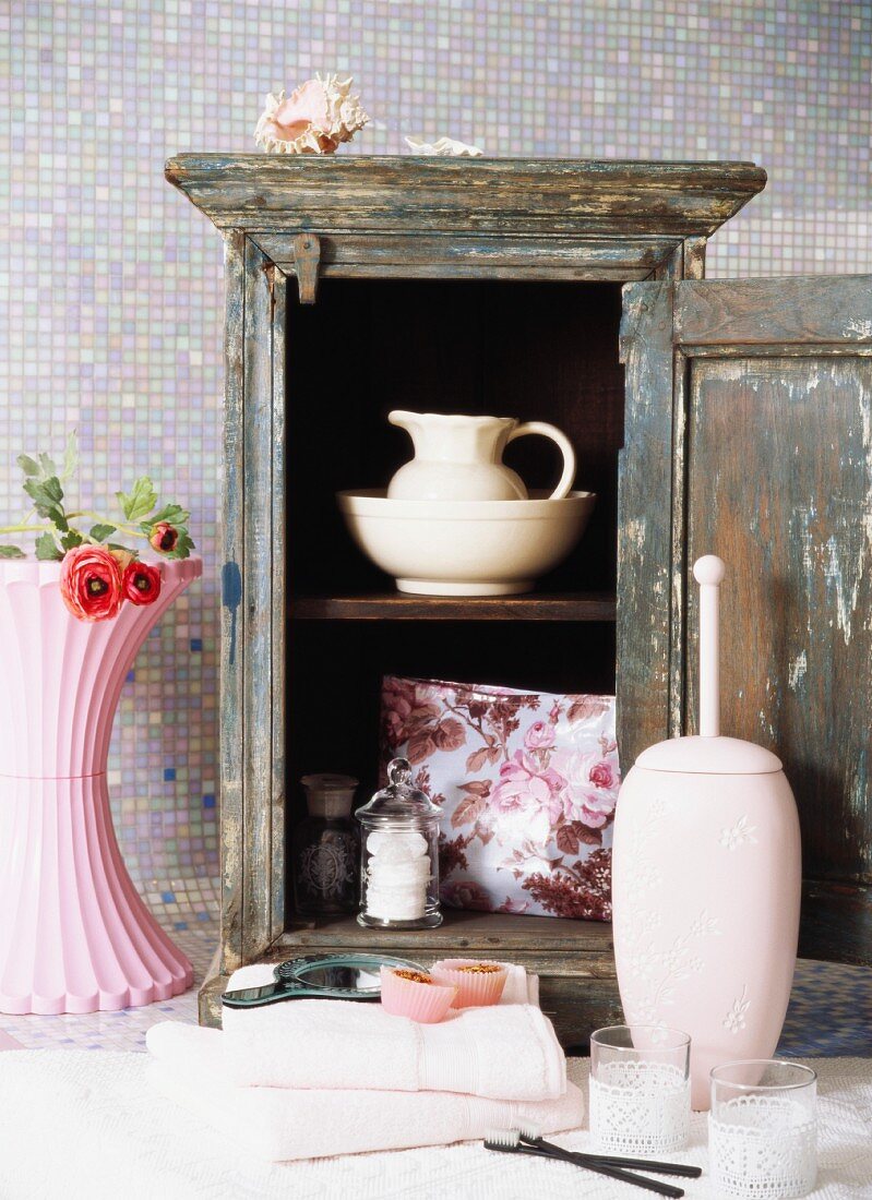 Old cupboard with crockery and toiletries