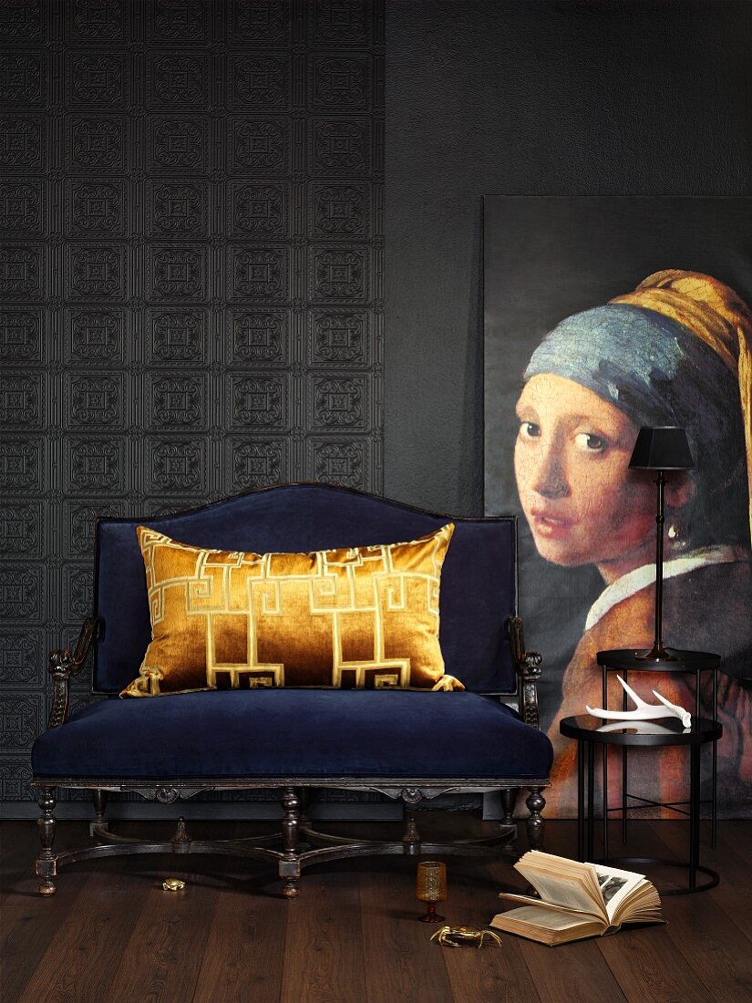 Reproduction of historical painting next to blue upholstered bench with gold velvet cushion