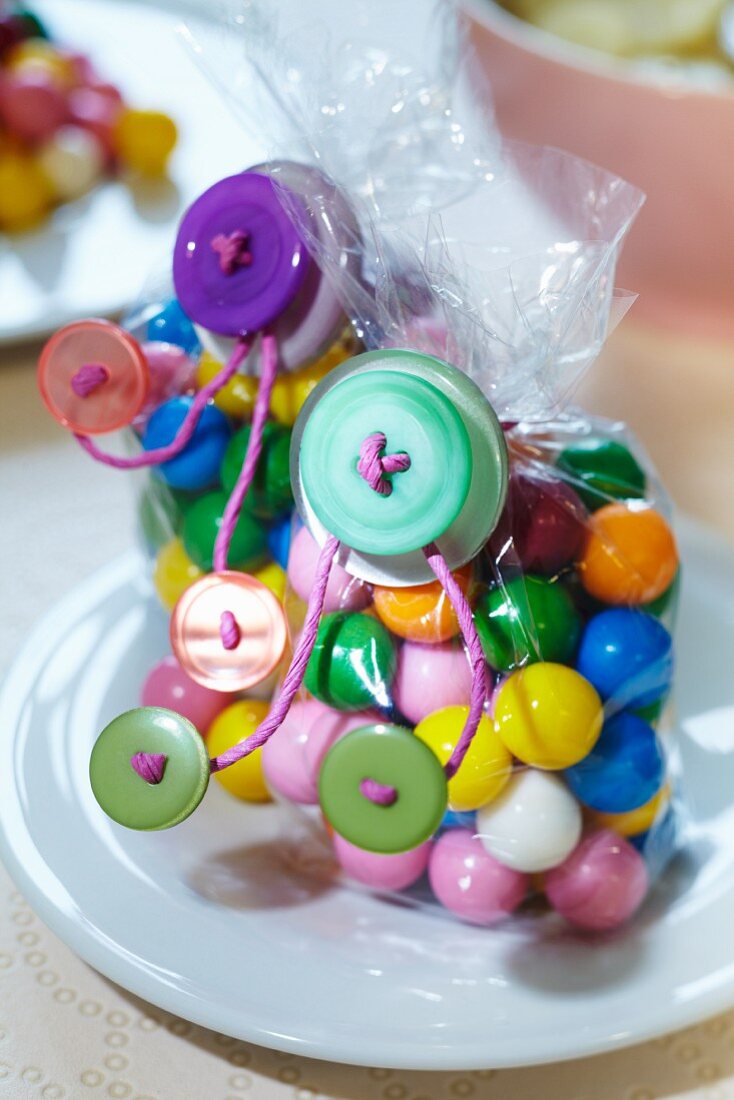 Bags of colourful sweets decorated with buttons