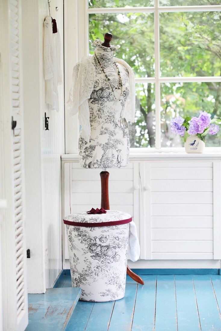 Tailors' dummy and laundry bin with hand-sewn covers of Toile de Jouy fabric