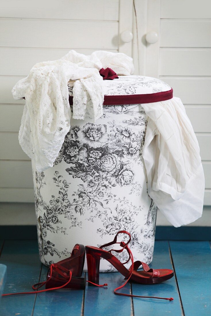 Laundry basket with hand-sewn, toile de jouy fabric cover