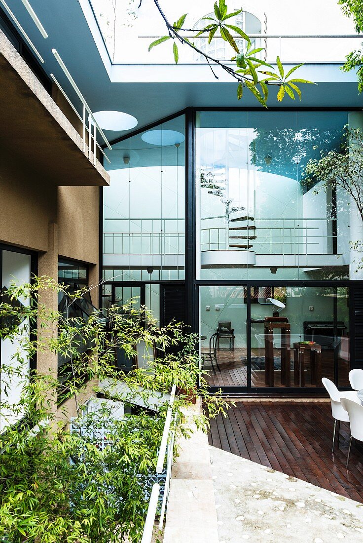 View from courtyard to glass facade of architect-designed house in Sao Paulo