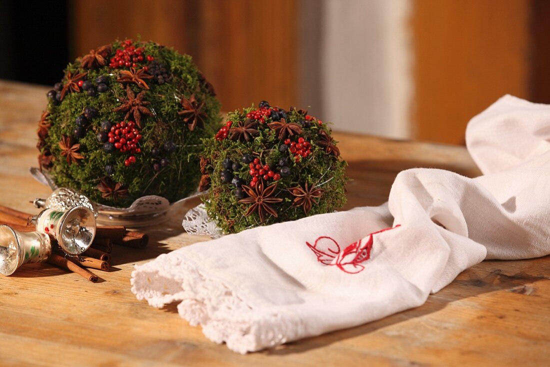 Hand-crafted Christmas moss pomander balls with spices
