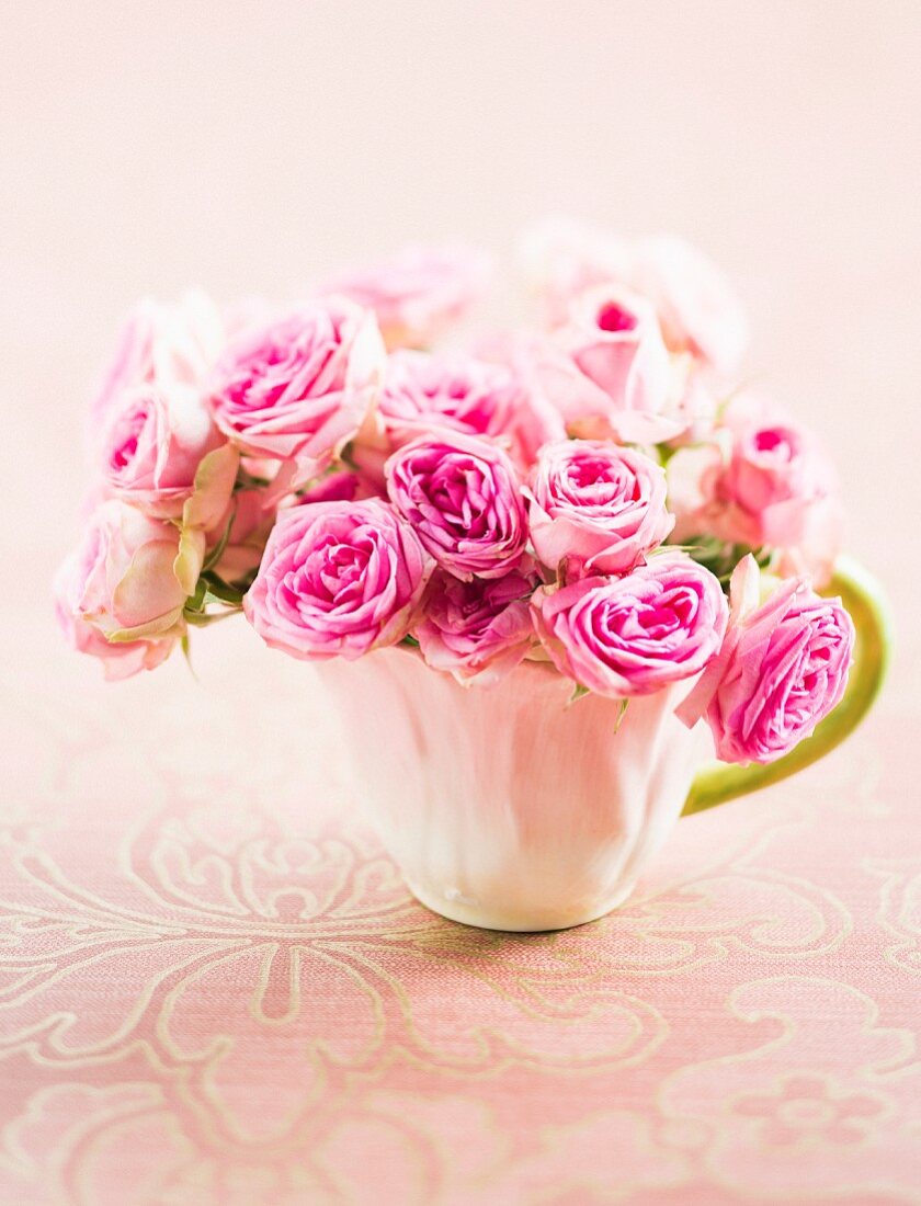 Posy of roses in teacup