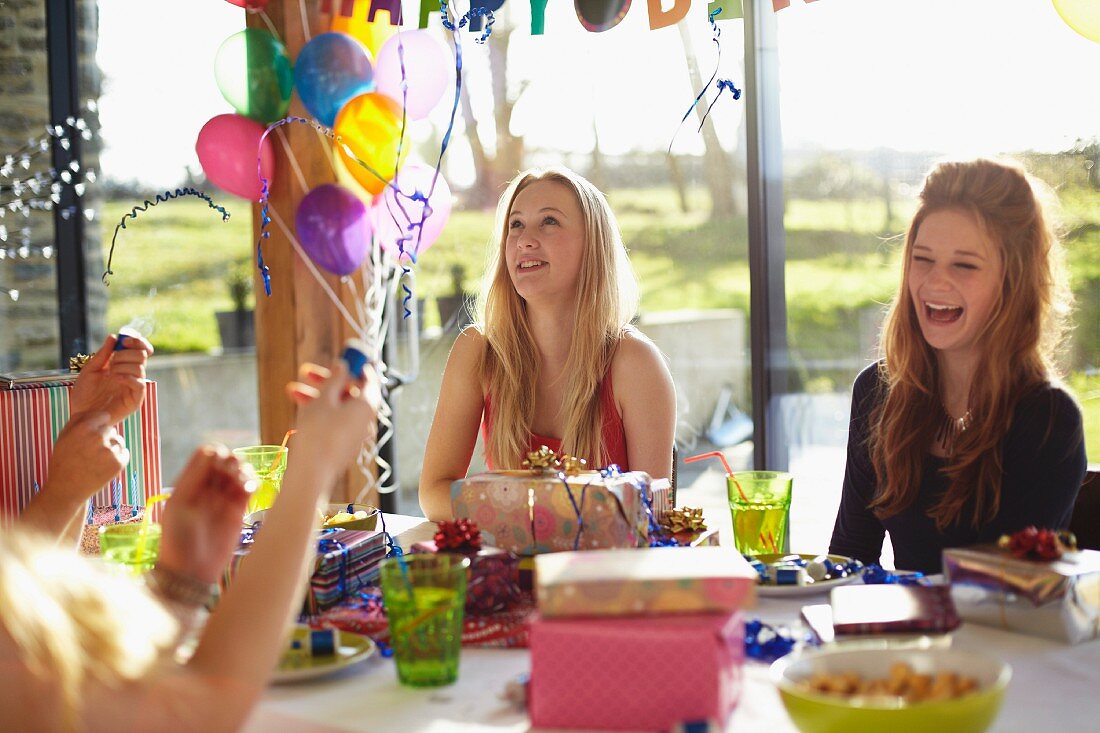 Several teenagers at a birthday party