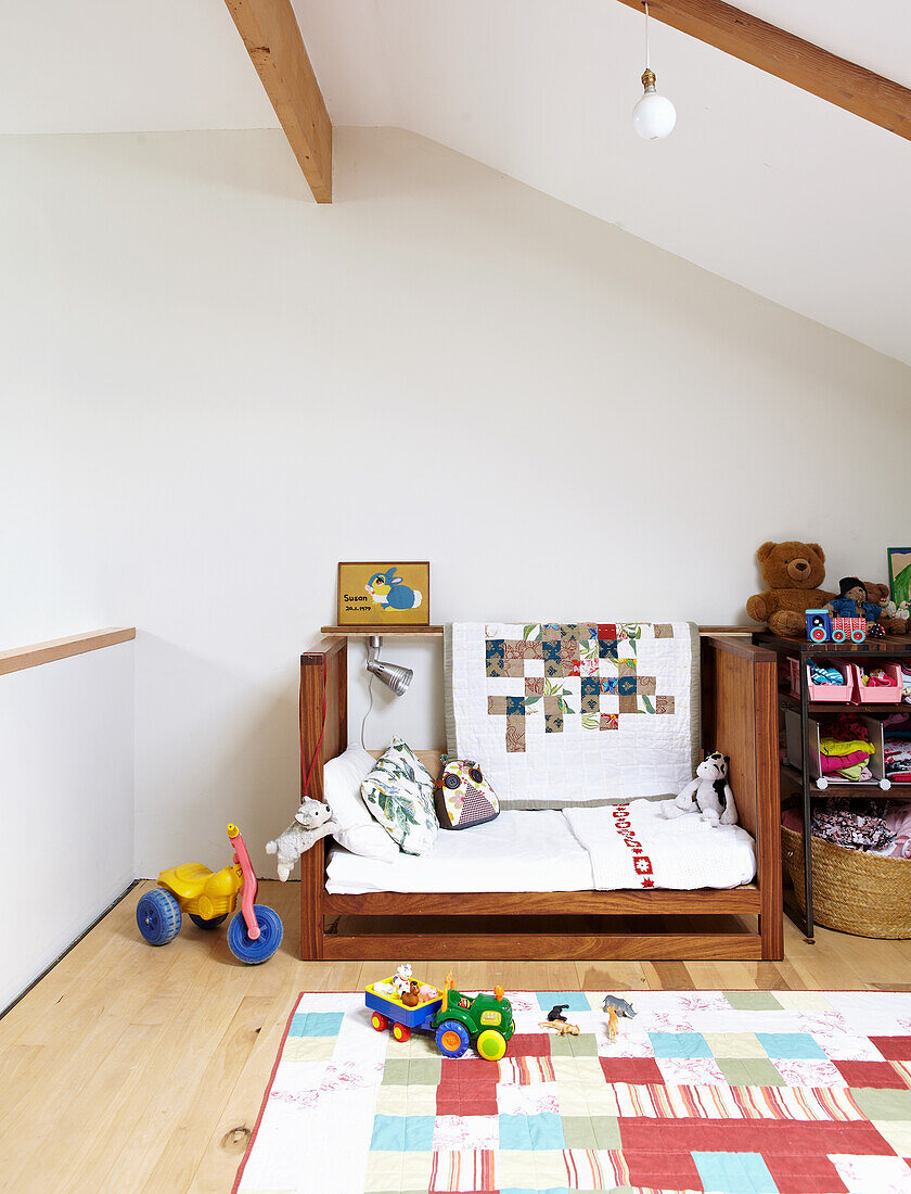 Children's room with vintage wooden bed in the attic