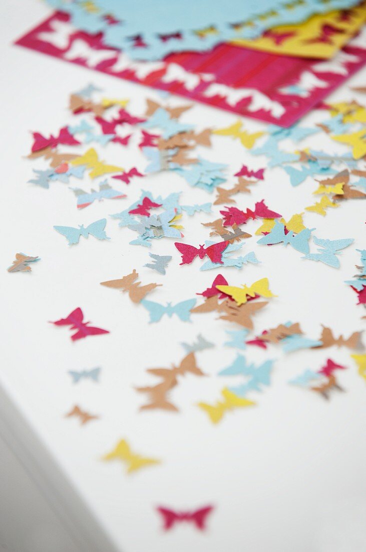 Colourful, butterfly confetti cut out using pattern punch