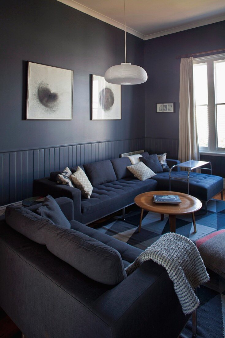 Comfortable sofa combination and classic coffee table in blue lounge area
