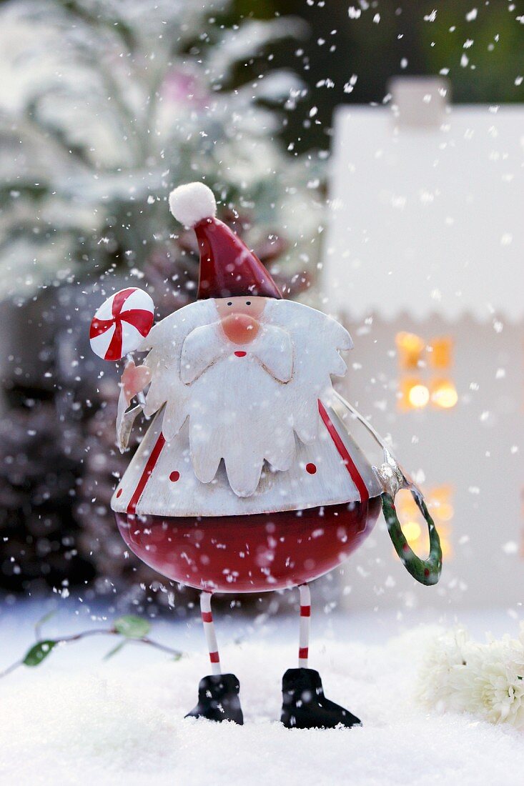 Father Christmas ornament on artificial snow