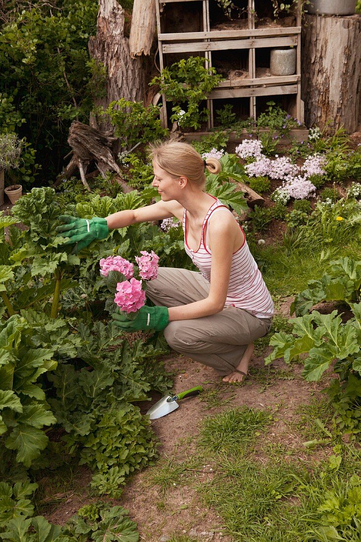 A young woman gardening
