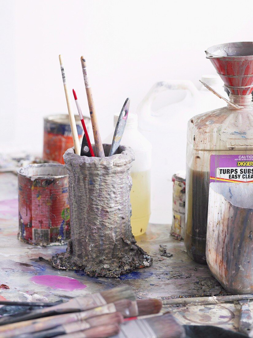 Painting utensils on table in artist's studio